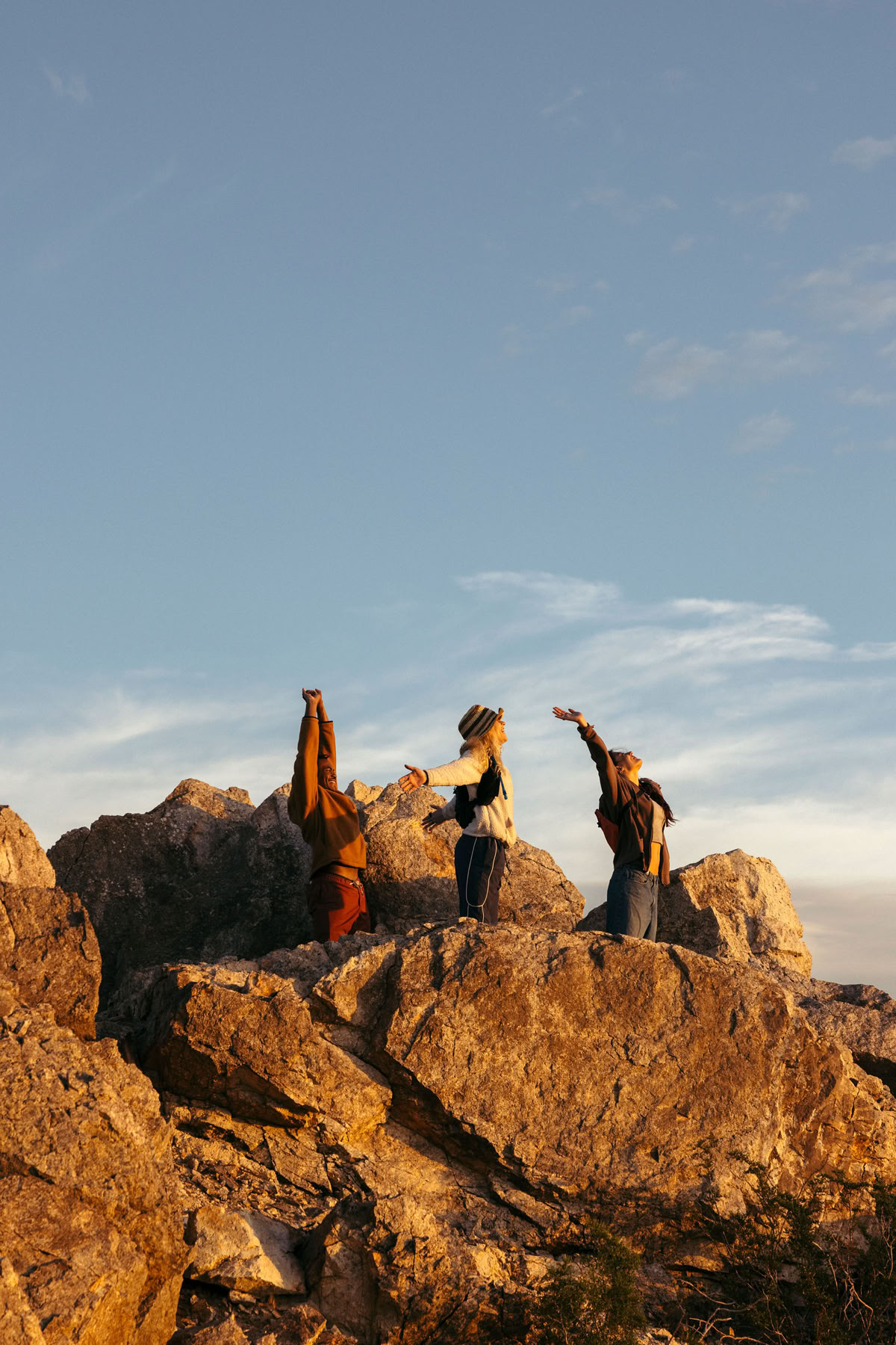 People celebrating on rocks